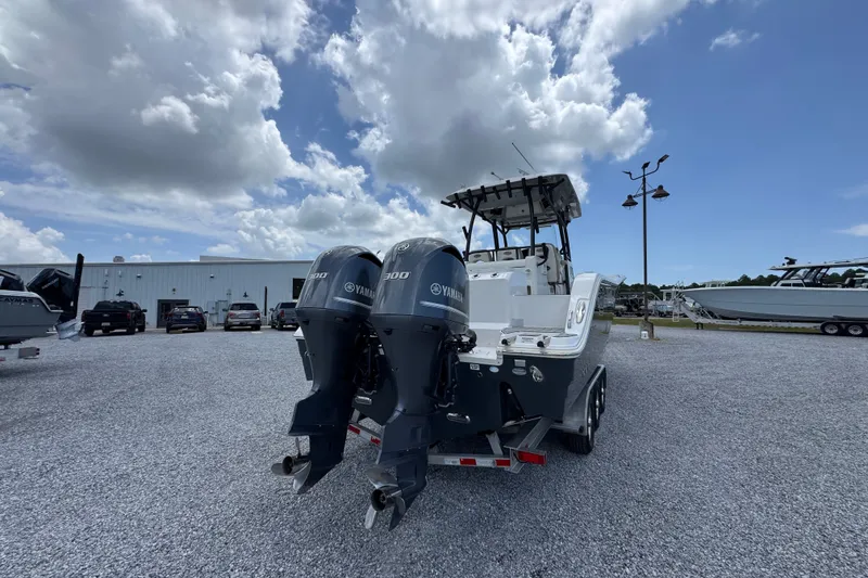 Slide: The Image of 2017 Sea Fox 328 Commander boat with twin Yamaha engines in a parking lot. - 16