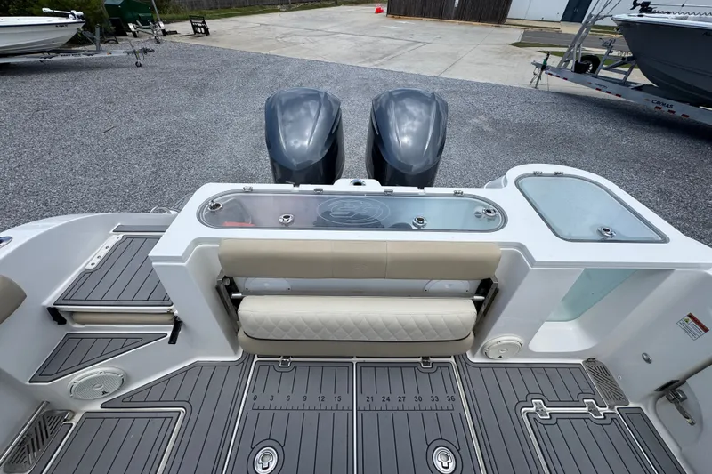Slide: The Image of 2017 Sea Fox 328 Commander boat deck with dual engines and seating area. - 48