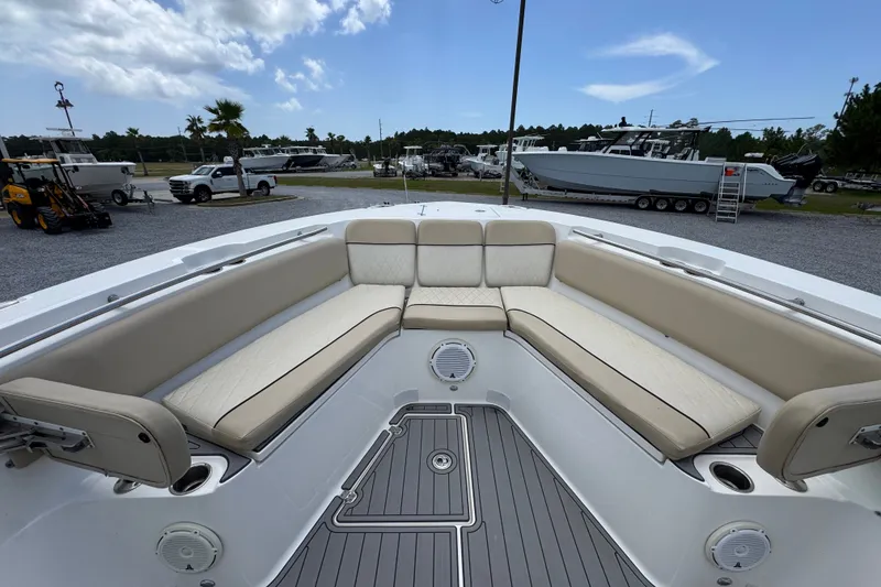 Slide: The Image of 2017 Sea Fox 328 Commander boat interior with beige seating and spacious deck. - 22