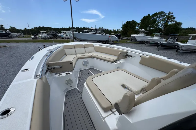 Slide: The Image of 2017 Sea Fox 328 Commander boat interior with beige seating and spacious deck. - 23