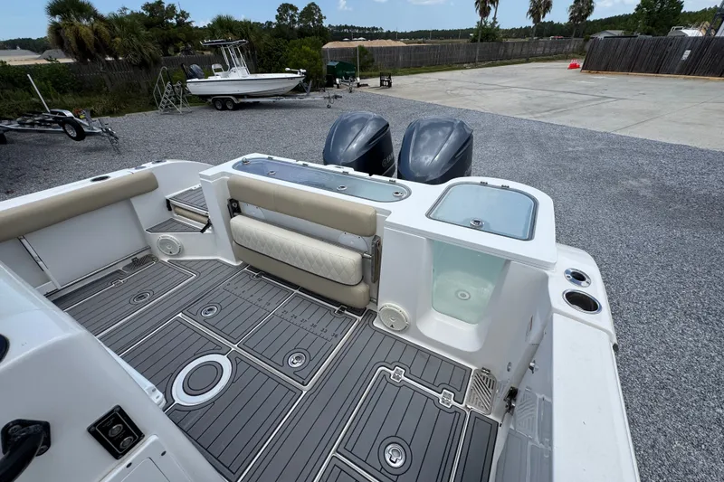 Slide: The Image of 2017 Sea Fox 328 Commander boat deck with dual engines and seating area. - 47