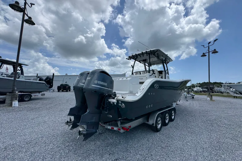 Slide: The Image of 2017 Sea Fox 328 Commander boat with dual Yamaha engines on a trailer. - 15