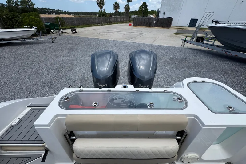 Slide: The Image of 2017 Sea Fox 328 Commander boat with dual 300 horsepower engines, docked outdoors. - 49