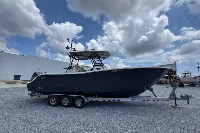 Slide: The Image of 2017 Sea Fox 328 Commander boat on trailer under cloudy sky. - 11