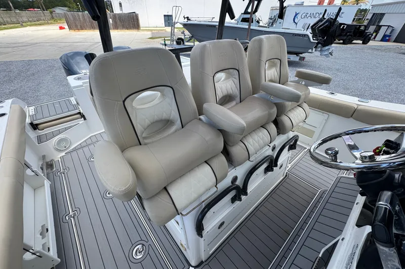 Slide: The Image of Luxurious seating on 2017 Sea Fox 328 Commander boat with beige upholstery and armrests. - 35
