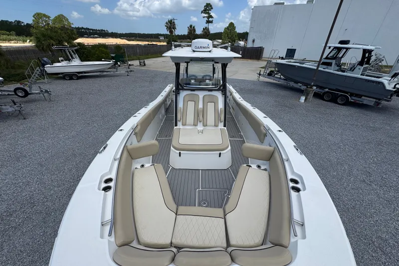 Slide: The Image of 2017 Sea Fox 328 Commander boat with spacious seating and Garmin equipment, parked outdoors. - 25