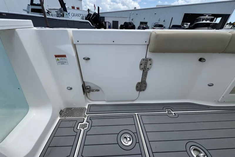 Slide: The Image of Interior view of a 2017 Sea Fox 328 Commander boat, featuring deck and seating. - 46