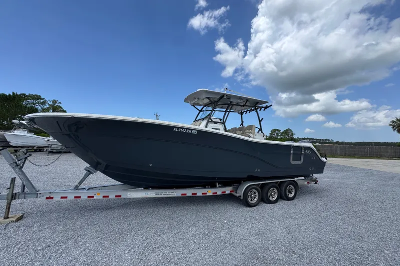 Slide: The Image of 2017 Sea Fox 328 Commander boat on a trailer under a blue sky. - 3