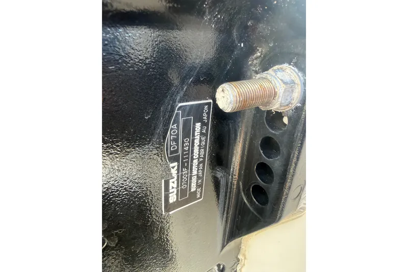 Slide: The Image of Close-up of Suzuki DF70A engine part on 2011 Carolina Skiff JVX18CC boat. - 26