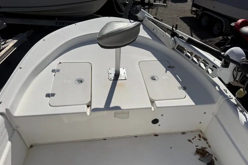 Slide: The Image of 2011 Carolina Skiff JVX18CC boat interior with storage compartments and seat. - 20