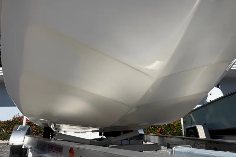 Slide: The Image of 2011 Carolina Skiff JVX18CC boat hull on trailer, close-up view. - 7