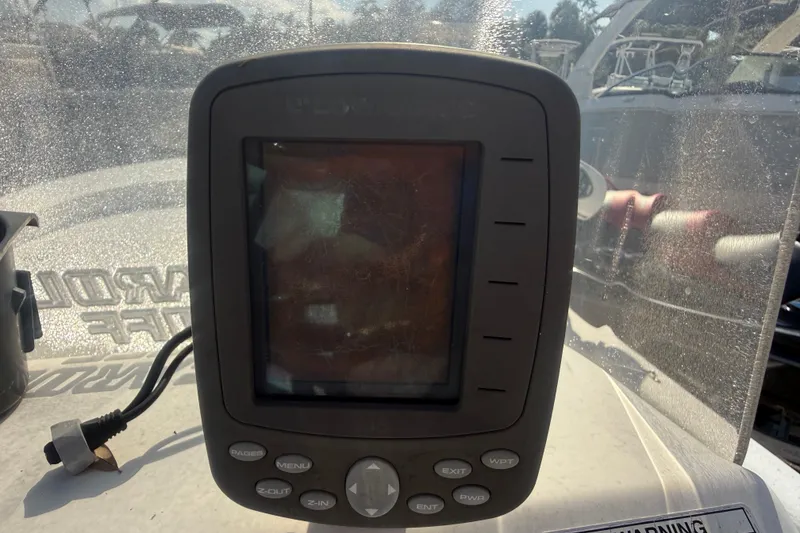 Slide: The Image of Fishfinder device on a 2011 Carolina Skiff JVX18CC boat dashboard. - 16