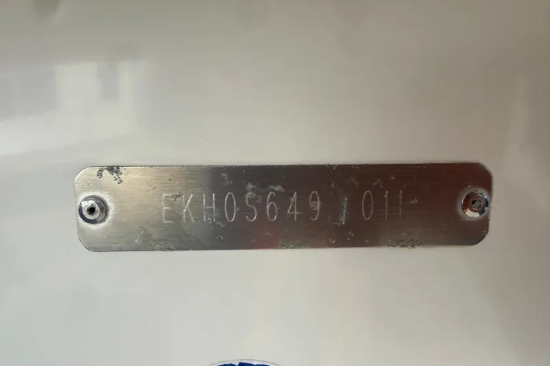 Slide: The Image of Metallic identification plate on a 2011 Carolina Skiff JVX18CC boat. - 25