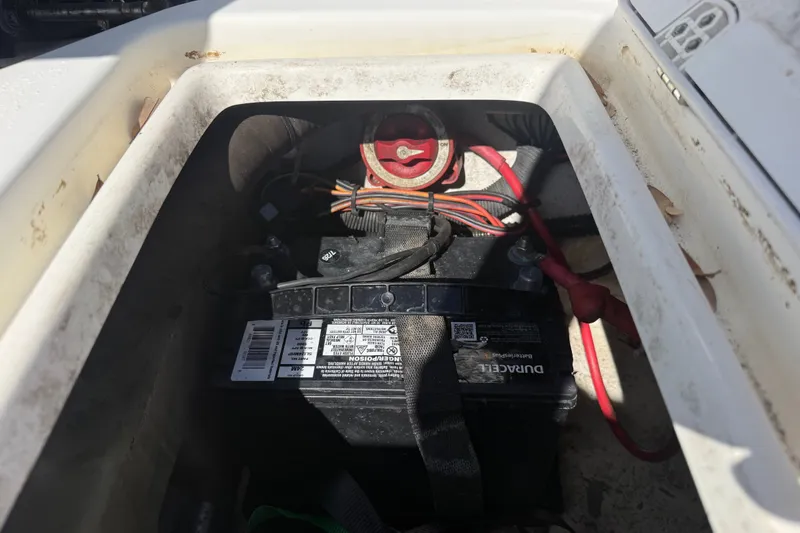 Slide: The Image of Battery compartment of a 2011 Carolina Skiff JVX18CC boat with wiring connections. - 9