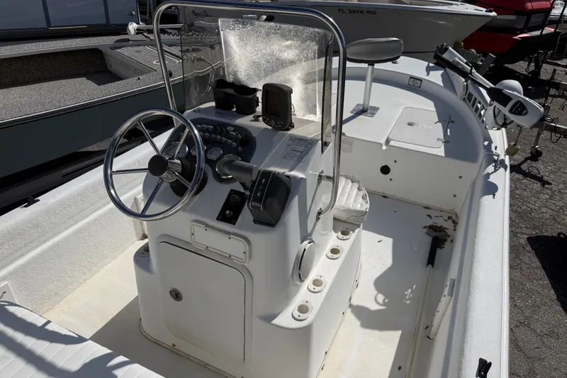 Slide: The Image of 2011 Carolina Skiff JVX18CC boat interior with steering console and seating. - 12