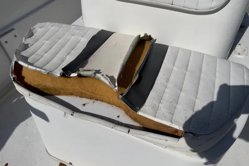 Slide: The Image of Damaged seat cushion on a 2011 Carolina Skiff JVX18CC boat. - 18