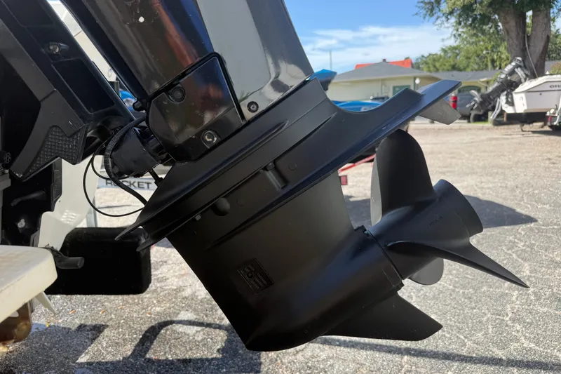 Slide: The Image of Close-up of a 2011 Carolina Skiff JVX18CC boat motor and propeller. - 5
