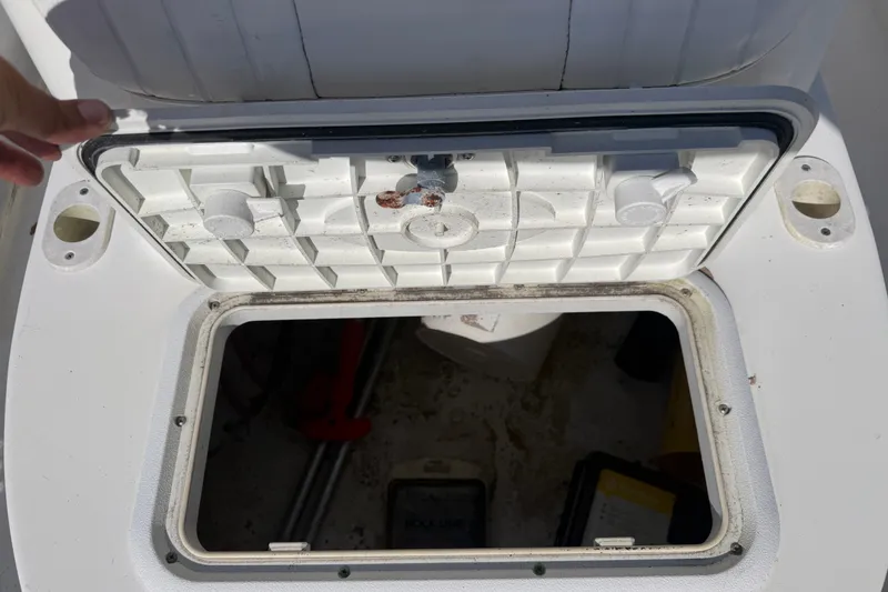 Slide: The Image of Open storage compartment on a 2011 Carolina Skiff JVX18CC boat. - 19