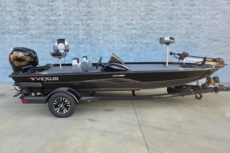 The Image of 2027 Vexus AVX1880 boat on trailer, sleek black design, modern fishing setup. - 1