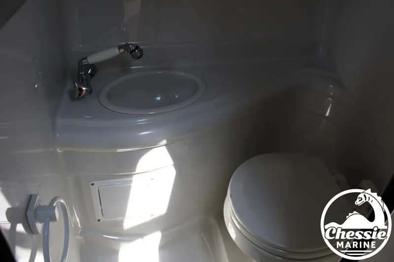 Slide: The Image of The image shows a boat bathroom with a sink and toilet. - 43