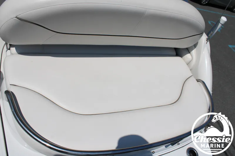 Slide: The Image of The image shows a white seat on a boat with a metal railing. - 14