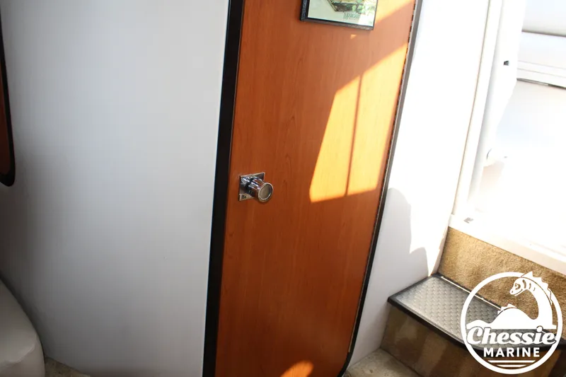 Slide: The Image of The interior view shows a wooden door with a metal handle and steps beside it. - 41