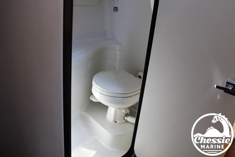 Slide: The Image of View of the bathroom in a 2006 Crownline 250 featuring a toilet. - 42