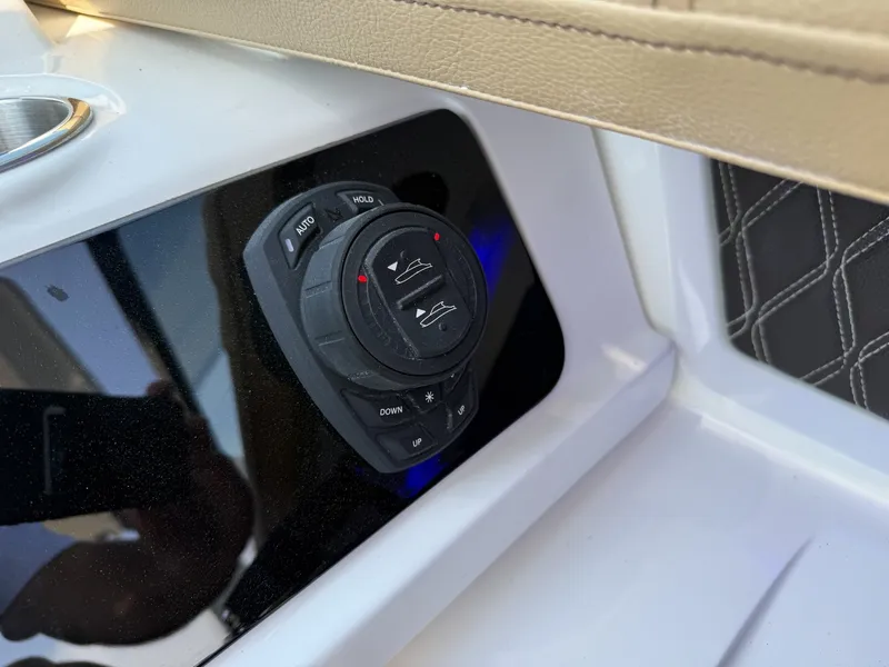 Slide: The Image of Close-up of a control panel on a 2027 Sea Ray SLX 310 boat. - 17