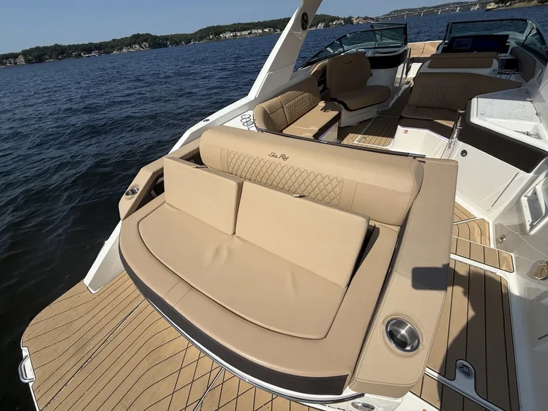 Slide: The Image of The image shows a 2027 Sea Ray SLX 310 boat with elegant seating and wooden flooring. - 8