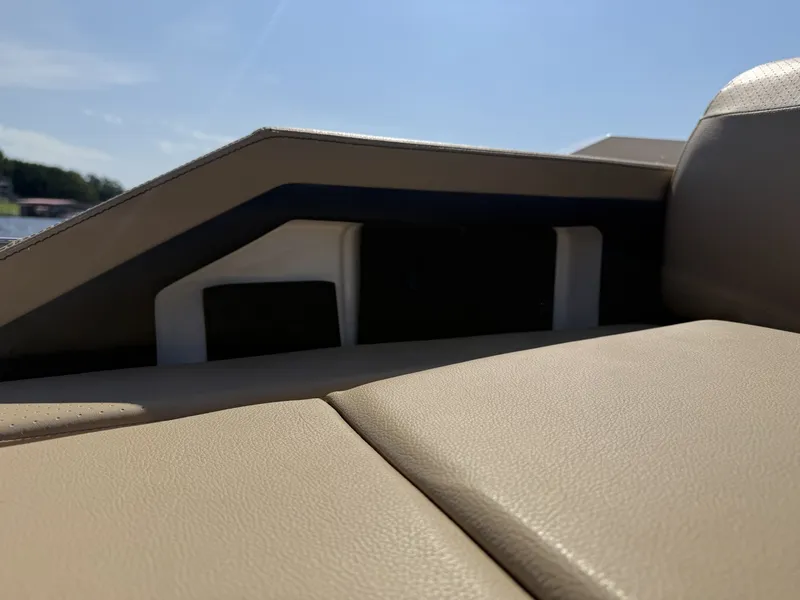 Slide: The Image of Close-up of a beige seat on a 2027 Sea Ray SLX 310 boat. - 11
