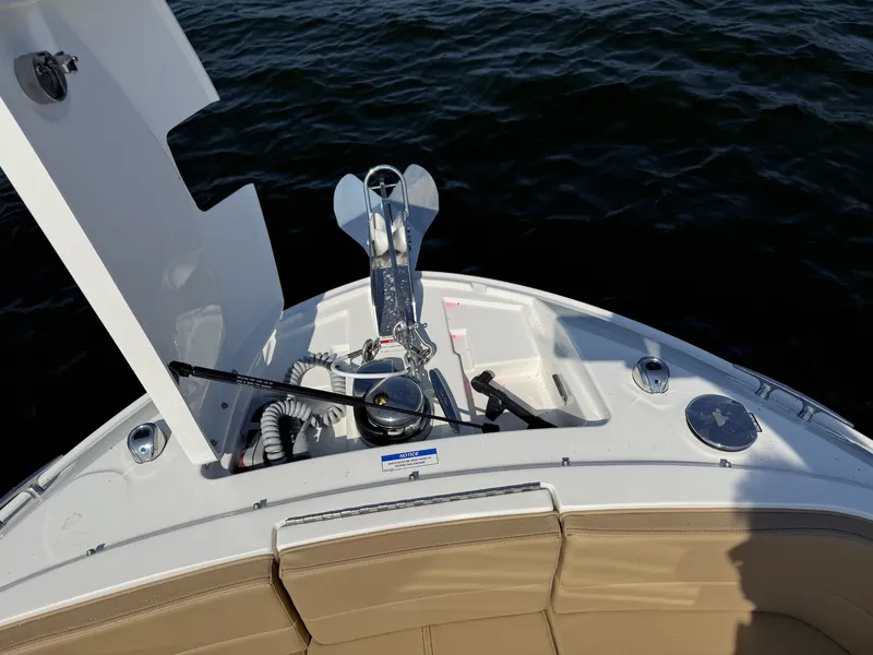 Slide: The Image of The bow of a Sea Ray SLX 310 with anchor and rope on the water. - 19
