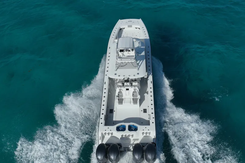 Slide: The Image of Aerial view of 2024 Freeman 42 boat cruising on clear turquoise water. - 22