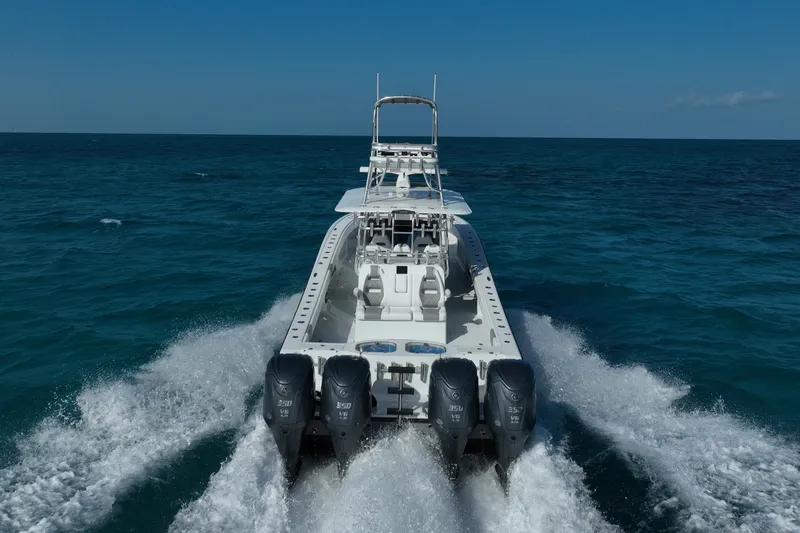 Slide: The Image of 2024 Freeman 42 boat cruising on open ocean with powerful engines. - 23
