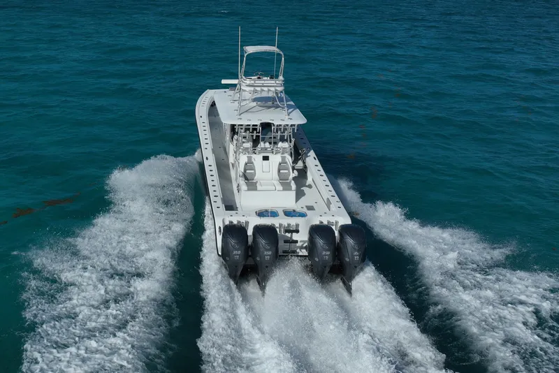 Slide: The Image of 2024 Freeman 42 boat cruising on clear blue ocean waters. - 21