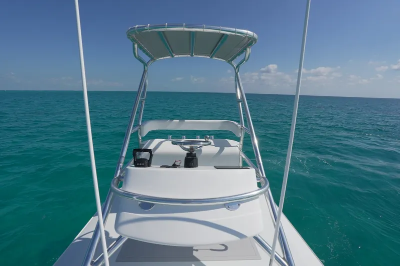 Slide: The Image of 2024 Freeman 42 boat on open ocean under clear blue sky. - 40