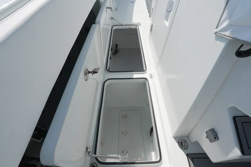 Slide: The Image of Open storage compartments on a 2024 Freeman 42 boat deck. - 50