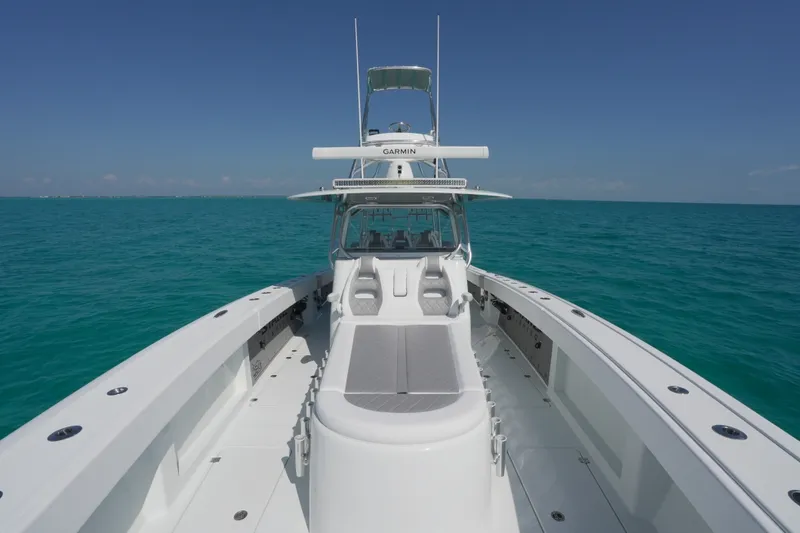 Slide: The Image of 2024 Freeman 42 boat on turquoise ocean under clear blue sky. - 49