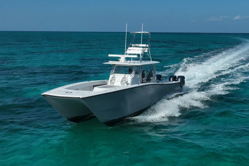 Slide: The Image of 2024 Freeman 42 boat cruising on clear blue ocean waters. - 16