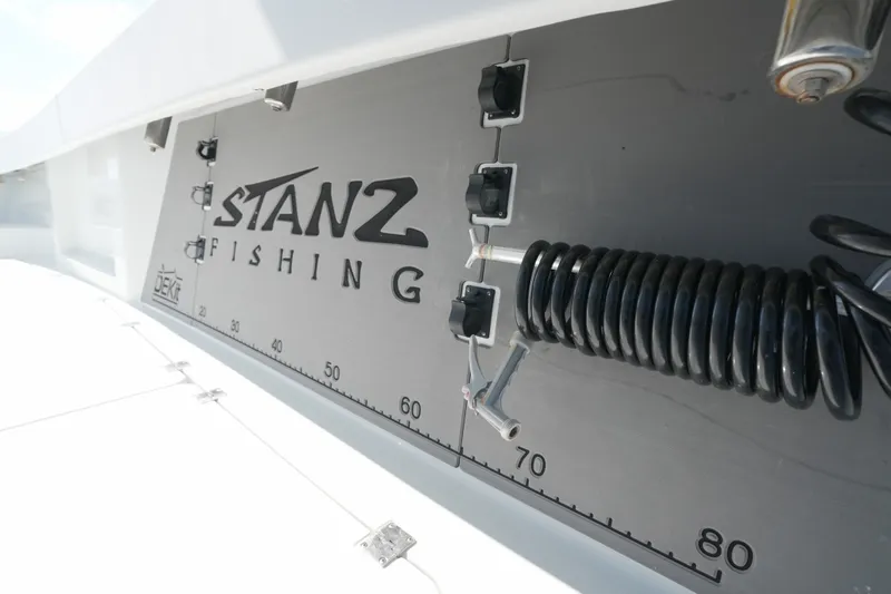 Slide: The Image of Freeman 42 boat deck with Stanz Fishing logo and measuring scale, 2024 model. - 55