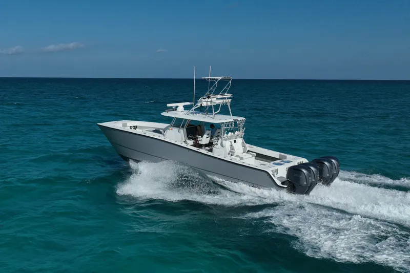 Slide: The Image of 2024 Freeman 42 boat cruising on open ocean with clear blue skies. - 20