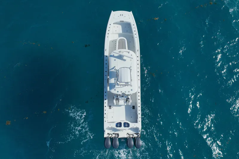 Slide: The Image of Aerial view of 2024 Freeman 42 boat on clear blue ocean water. - 13