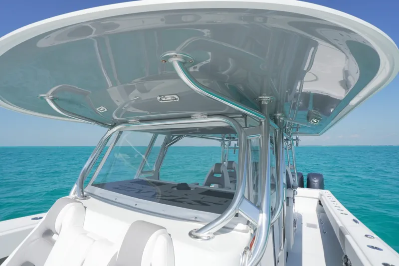 Slide: The Image of 2024 Freeman 42 boat with sleek design on turquoise ocean waters. - 52