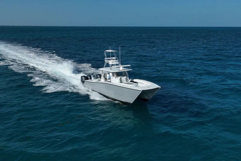 Slide: The Image of 2024 Freeman 42 boat cruising on open ocean waters. - 26
