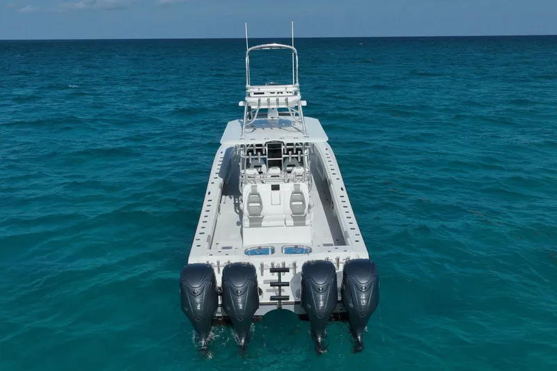 Slide: The Image of 2024 Freeman 42 boat with four engines on open ocean. - 14