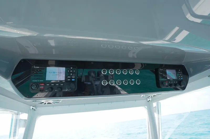 Slide: The Image of Control panel of 2024 Freeman 42 boat with electronic displays and buttons. - 54