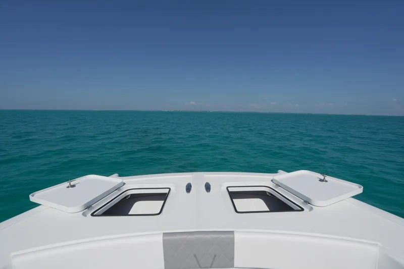 Slide: The Image of Bow view of 2024 Freeman 42 boat on open ocean under clear blue sky. - 36