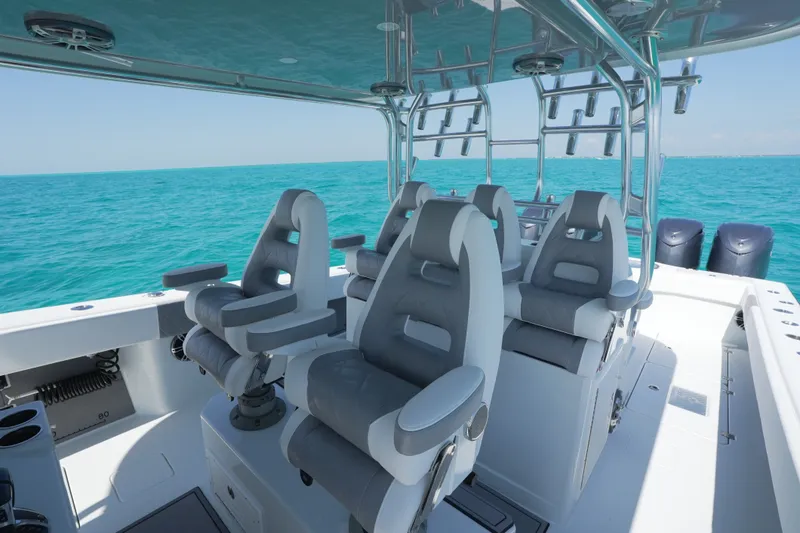 Slide: The Image of 2024 Freeman 42 boat interior with luxurious seating on turquoise water. - 53