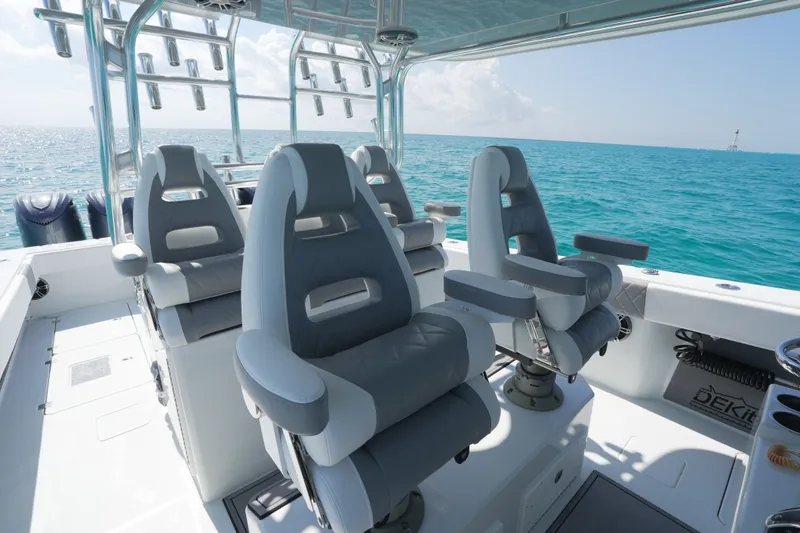 Slide: The Image of Luxury seating on 2024 Freeman 42 boat, ocean backdrop, sunny day. - 31