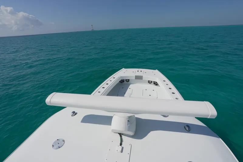 Slide: The Image of Bow view of 2024 Freeman 42 boat on turquoise ocean waters. - 39