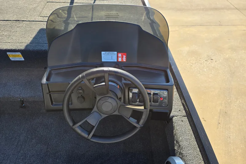 Slide: The Image of Steering console of 2027 Lowe Skorpion 16 boat with controls and dashboard. - 5